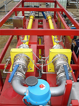 side view: a complete turnkey system that includes three Voraxial® Separators working in parallel and in series, separating sand from water at rates of up to 30,000 barrels per day. The Voraxial® system is installed via hose connection